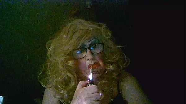 Disgusting mature tranny milf, Sarah Millward, smokes, wanks  her clit, and fucks her arsehole cunt with 9 inch bbc dildo